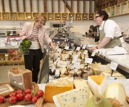 Holwood_Farm_lady_choosing_cheese.jpg